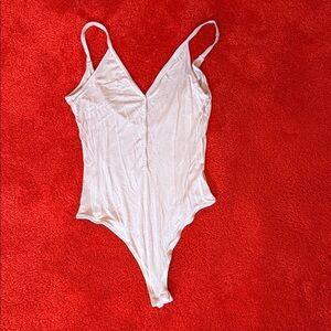 Me to We Pink Button-Up bodysuit